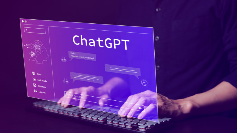 A person types on a keyboard with a virtual screen displaying "chatgpt" in front of them. The screen shows a chat interface with messages, clear, login, updates, and logout options, alongside a small chatbot icon for easy troubleshooting.